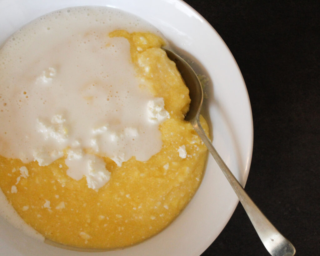 Polenta with cheese and yoghurt in a bowl